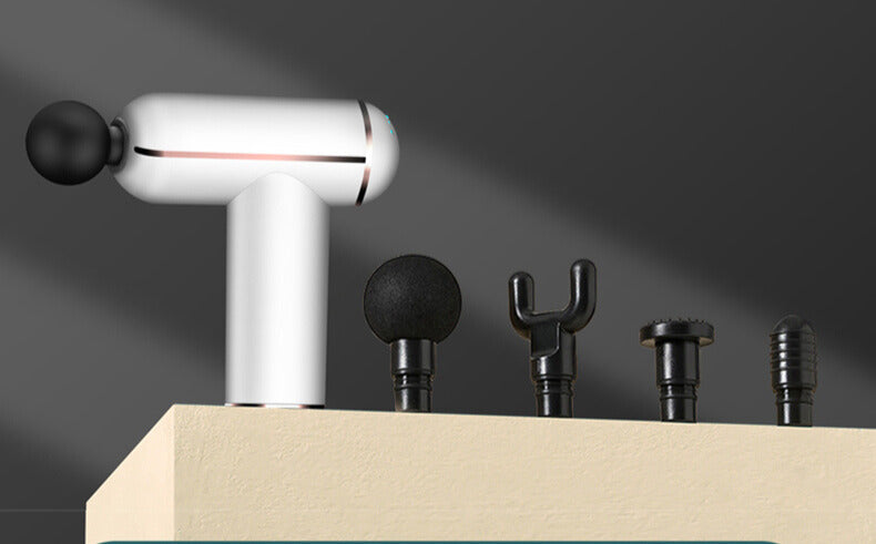 pistolet massage avec 4 têtes de massage